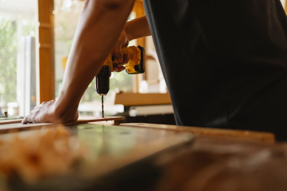 Carpenter installing a new wooden door